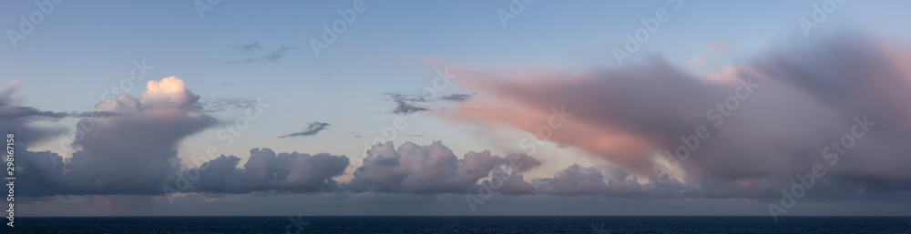 Dramatic Panoramic View of a cloudscape during a dark, rainy and colorful sunrise. Taken over the Pacific Ocean in Alaska, USA. - obrazy, fototapety, plakaty 