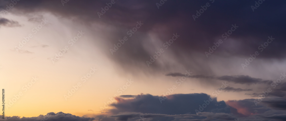 Dramatic Panoramic View of a cloudscape during a dark, rainy and colorful sunset. Taken in Alaska, USA. Dramatic Panoramic View of a cloudscape during a dark, rainy and colorful sunset. Taken in Alaska, USA.