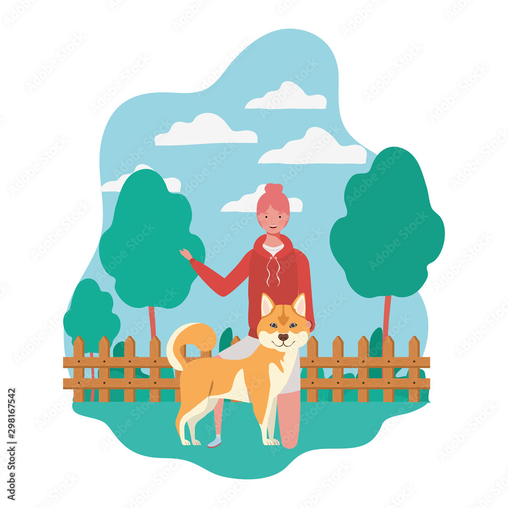 Naklejka premium young woman with cute dog in the field