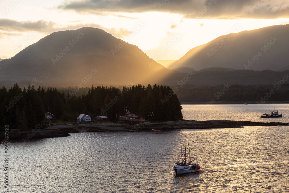 Beautiful Aerial View of homes and boats near a historic town on the Ocean Coast during a dramatic stormy sunset. Taken in Ketchikan, Alaska, United States.