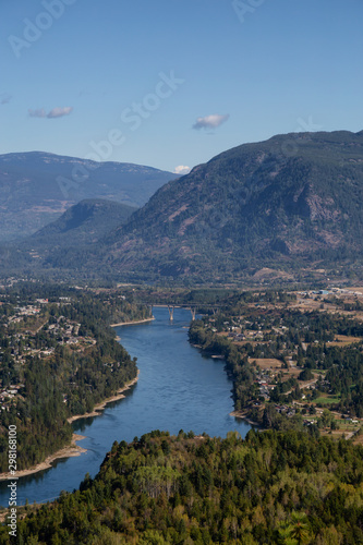 Aerial View of a small town, Castlegar, during a sunny summer day. Located in Central Kootenay, British Columbia, Canada.