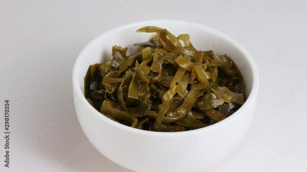Salad of marinated sliced laminaria and sesam. Salad of marinated sliced laminaria and sesam.