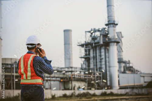 Engineer work at siteline, specialist engineer using mobile phone work at poer plant siteline 