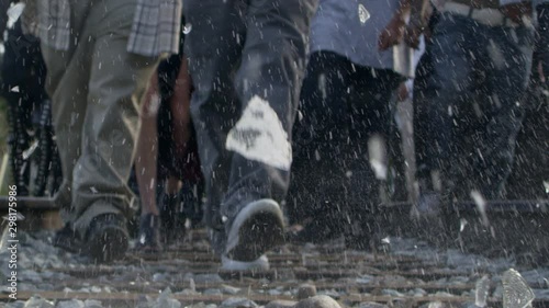 Man smashes a glass bottle on railroad tracks photo