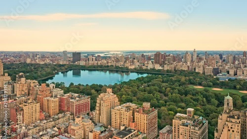 Aerial drone footage of New York Central Park and Upper West Side neighborhood at sunset.