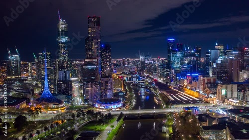 Aerial hyperlapse of night Melbourne CBD at Flinders Street in Melbourne along with Yarra River, Australia