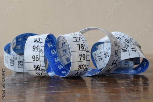 measuring tape on wooden table photo