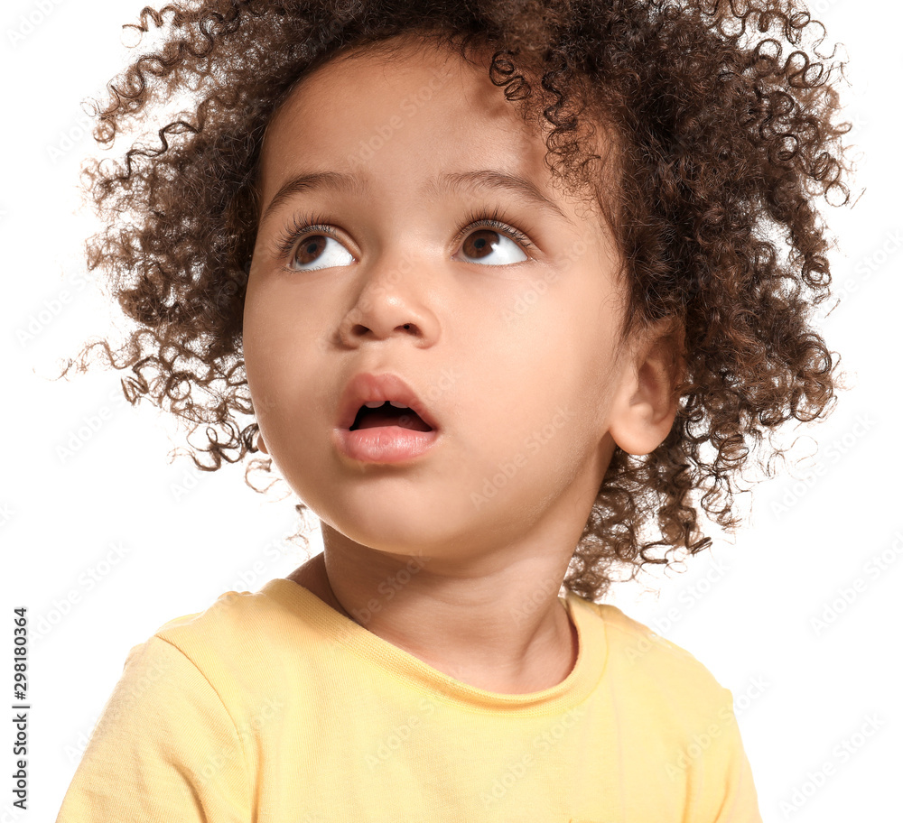 Portrait of little African-American girl on white background
