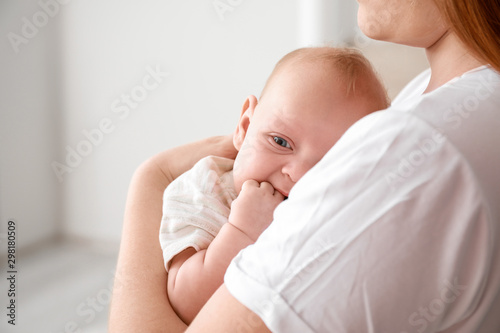 Mother with cute baby at home