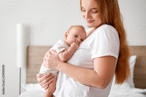 Mother with cute baby at home