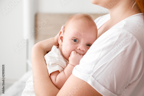Mother with cute baby at home