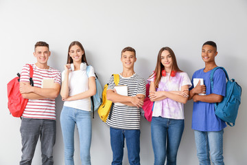 Portrait of cool teenagers on white background