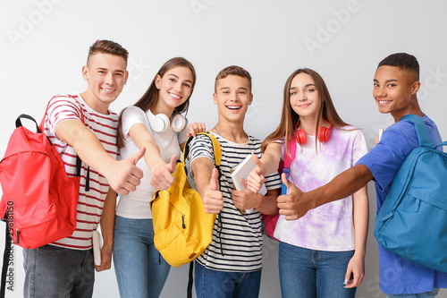 Cool teenagers showing thum...