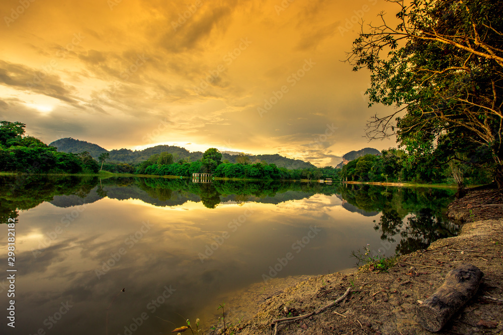 Natural background of a large reservoir in Krabi,Thailand(Nong Thale)atmosphere surrounded by mountains,trees of various sizes, blown through the wind,blurred cool during the day,a viewpoint of travel Natural background of a large reservoir in Krabi,Thailand(Nong Thale)atmosphere surrounded by mountains,trees of various sizes, blown through the wind,blurred cool during the day,a viewpoint of travel