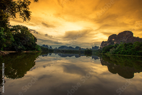 Natural background of a large reservoir in Krabi,Thailand(Nong Thale)atmosphere surrounded by mountains,trees of various sizes, blown through the wind,blurred cool during the day,a viewpoint of travel