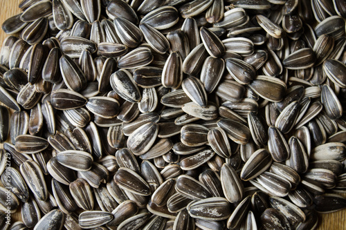 The texture of the seeds. Sunflower seeds on the table. Culinary background for design.