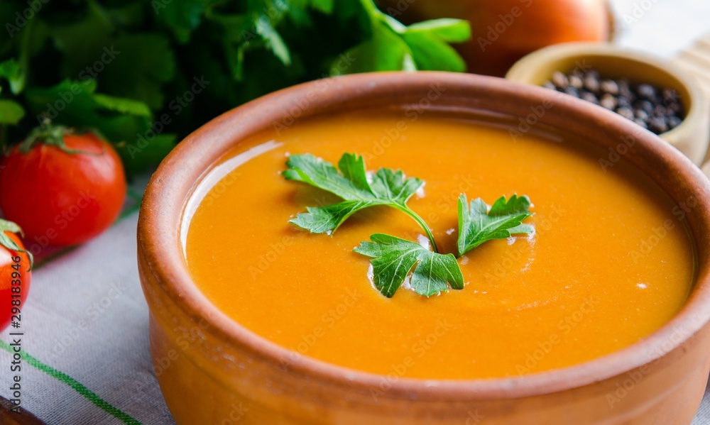 Pumpkin soup served on the table in bowl Pumpkin soup served on the table in bowl