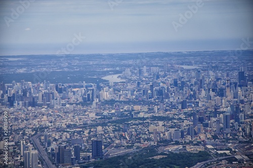 Aerial view of Bangkok Thailand and surrounding landscape, modern office buildings, condominium, living place in Bangkok city downtown in the most populated. Southeast Asia. © Jeremy