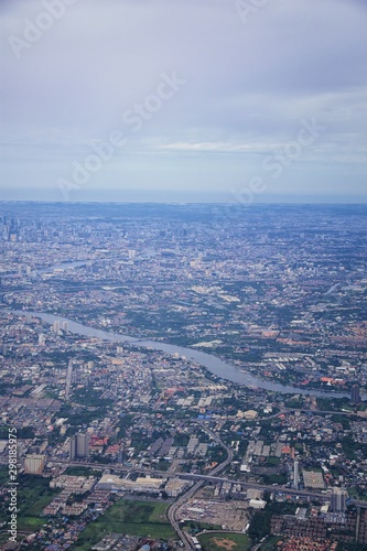 Aerial view of Bangkok Thailand and surrounding landscape, modern office buildings, condominium, living place in Bangkok city downtown in the most populated. Southeast Asia. © Jeremy