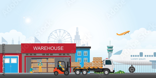 Workers loading the truck with packaged goods at warehouse building.