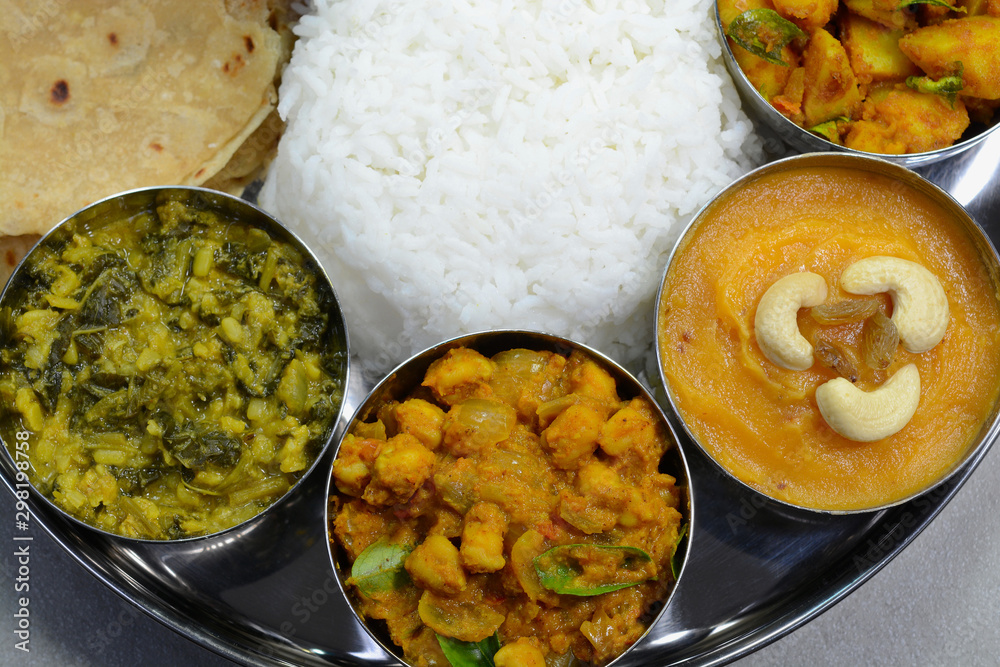 Indian food thali with rice, roti and curry dishes Stock Photo | Adobe ...