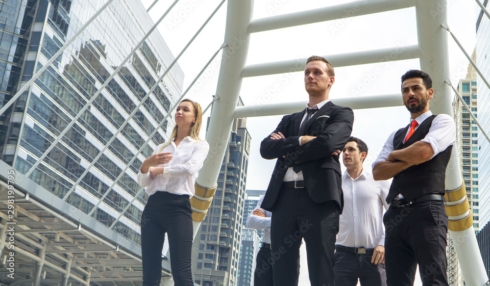 Group of business people with businessman leader on foreground Group of business people with businessman leader on foreground