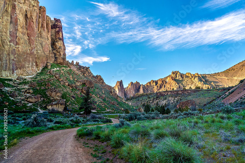 A hiking trail at Smith Rock State Park near Redmond, Oregon, United States during a glowing sunset afternoon. photo