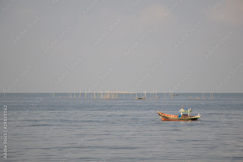 Fishing boats on the sea with blue sky  background.Bang Saen Beach,Chonburi district,Thailand.