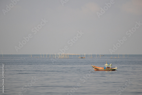 Fishing boats on the sea with blue sky background.Bang Saen Beach,Chonburi district,Thailand.