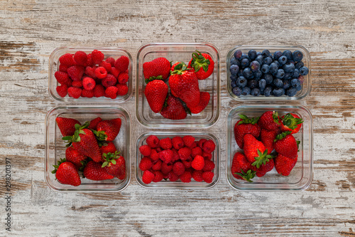 fresh healthy berries in containers