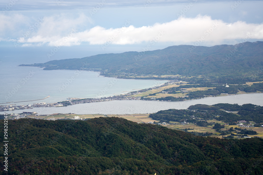 Fototapeta premium Niigata,Japan-October 22, 2019: Panoramic view of Kuninaka Plain under sea of clouds in Sado Island, Niigata, Japan