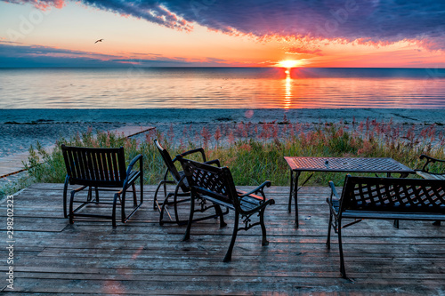 Table and chairs, resort on the Baltic beach at sunset
