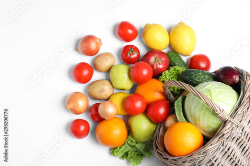Creative composition with fresh vegetables and fruits on white background, top view
