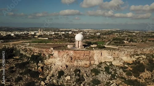 Aerial, rotating view of the dingli radar station. photo