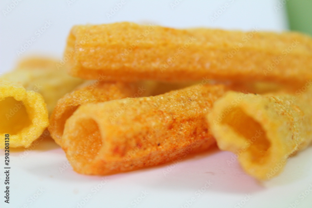 closeup shot of crispy fried roll pappad snacks with white background closeup shot of crispy fried roll pappad snacks with white background
