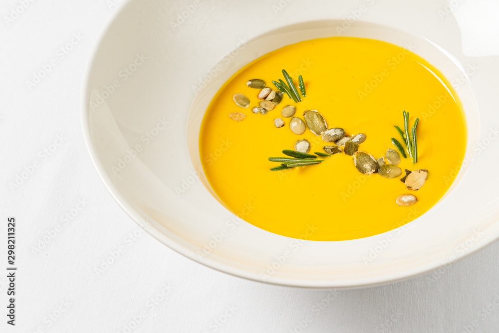 pumpkin cream soup on the white background pumpkin cream soup on the white background