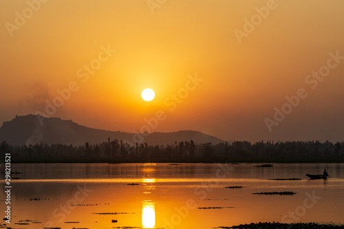 Majestic sunset view over Dal Lake in Kashmir, India. Since 1947 the ownership of Kashmir has been disputed between Pakistan and India.