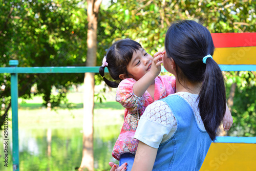 Little Child Girl Very Happy and Smile with Mother at The Public Park
