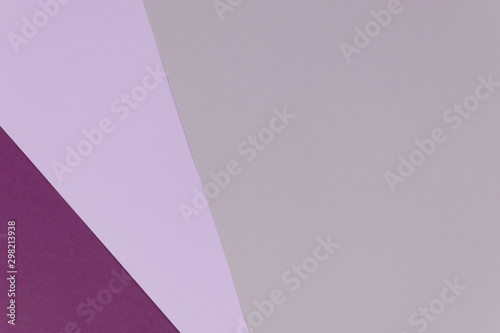 Three sheets of gray, violet anf lilac paper overlapping each other