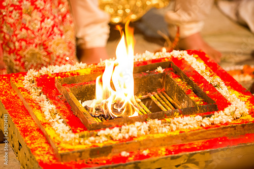 Obraz na plátně Holy fire in traditional indian hindu wedding puja ritual taking place in mandap wedlock