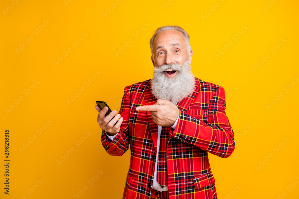 Photo of hipster grandpa white beard guy holding telephone hand indicating  finger advising discount price wear plaid red blazer tie clothes isolated  yellow color background Photos | Adobe Stock