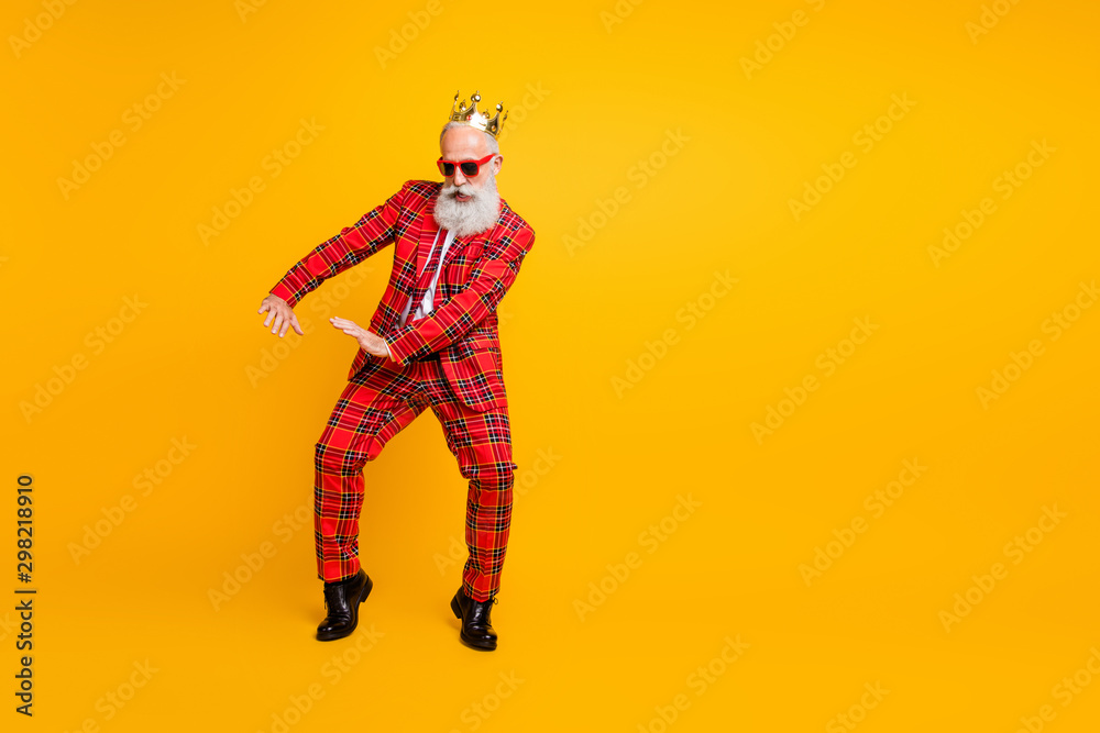 Full body photo of funny grandpa white beard dancing strange youngster moves little drunk wear crown sun specs gingham red costume isolated yellow color background