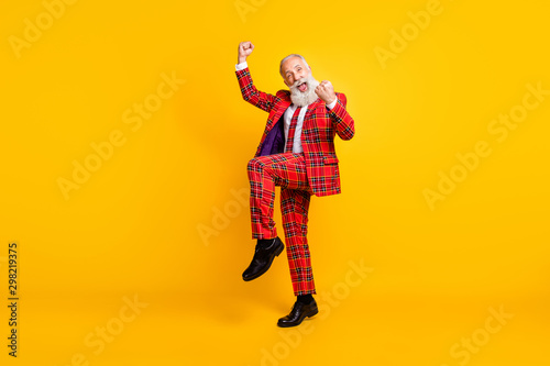 Full length body size view of his he nice handsome attractive cheerful cool lucky gray-haired man winner celebrating luck win isolated over bright vivid shine vibrant yellow color background