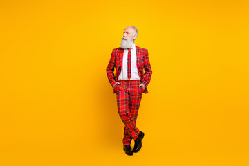 Full body photo of cool grandpa guy white beard groom man looking empty space thinking over wedding speech wear red blazer tie pants outfit isolated yellow color background