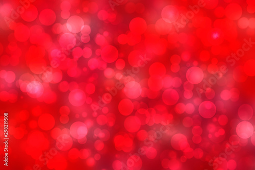 Abstract festive blurred red background texture with bokeh circles and lights for Valentine or wedding day. Card concept. Space for design.