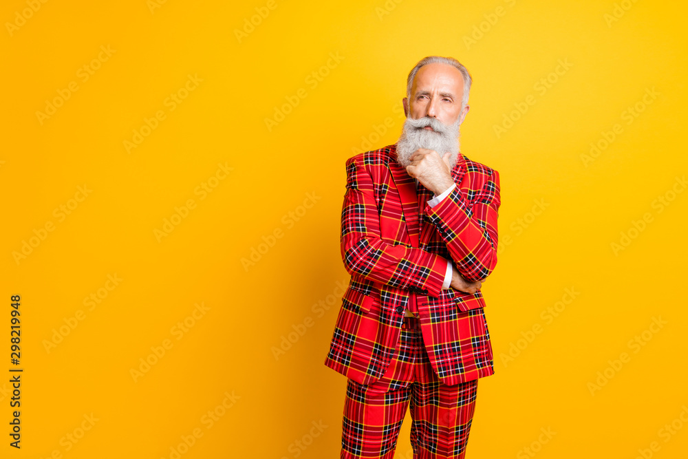 Photo of cool modern grandpa model guy deep thinking hand on chin looking empty space wear red gingham blazer tie trousers clothes isolated yellow color background Photo of cool modern grandpa model guy deep thinking hand on chin looking empty space wear red gingham blazer tie trousers clothes isolated yellow color background