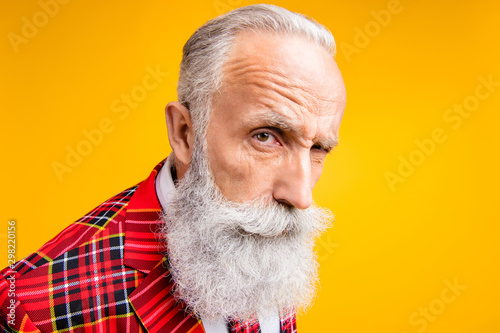 I think you are liar. Closeup photo of cool grandpa guy stylish long beard have doubts looking suspicious wear tartan blazer outfit isolated yellow color background photo