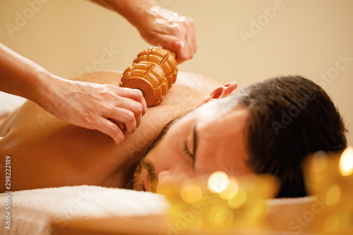 Close-up of back massage in spa center.