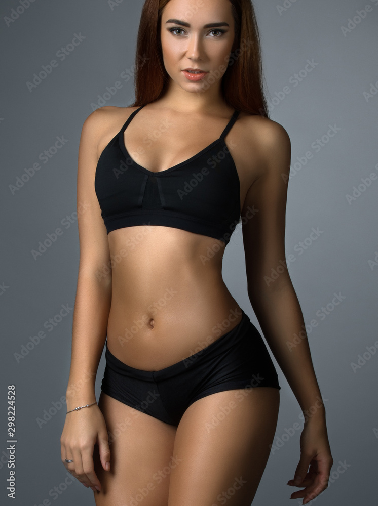 Pretty fitness trainer in black top and short Pretty fitness trainer in black top and short