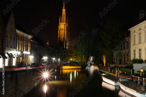 Bruges night street and river tourism photo